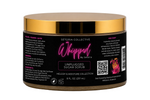 A jar of Setoria Collective Whipped by Setoria Unplugged Sugar Scrub, featuring a black label with pink and white text and a metallic gold lid, set against a white background.